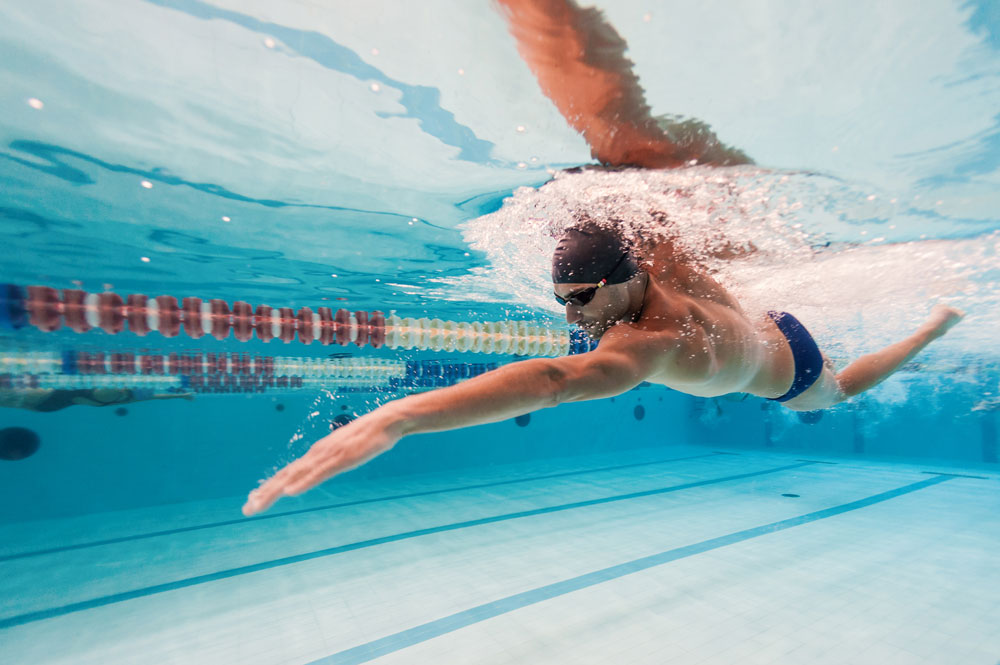 man-swimming-in-lane-under-water